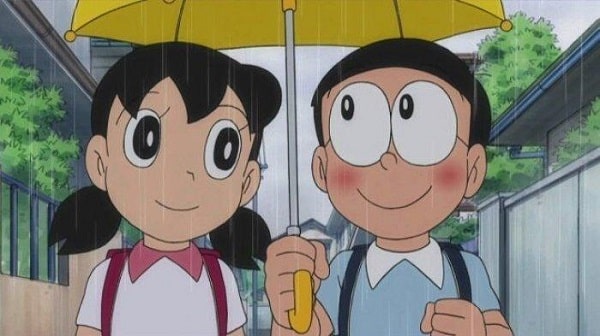 Hình ảnh của Nobita và Shizuka cầm ô đi bộ dưới mưa
